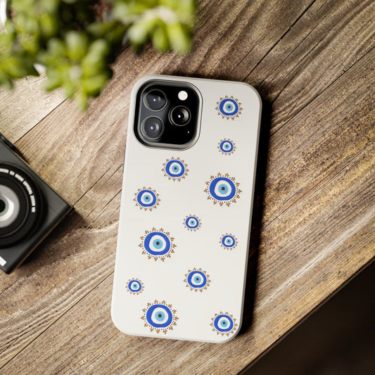 White phone case with blue evil eye patterns from By Yas Evil Eye 2 collection