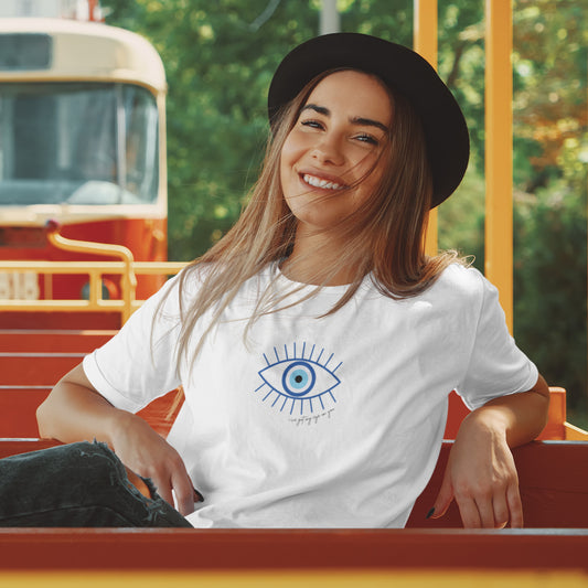 White t-shirt with a blue eye design printed on the front